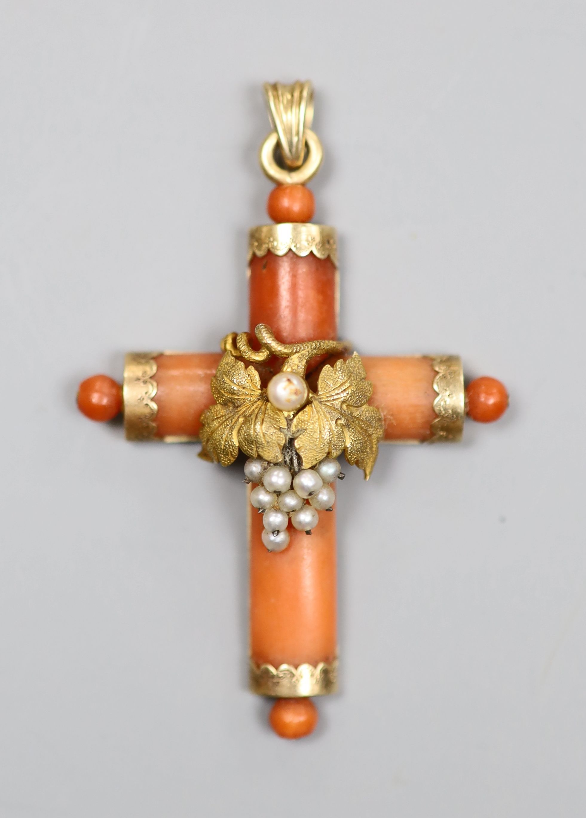 A 19th century yellow metal and seed pearl mounted coral cross pendant, 38mm, gross 5.7 grams.